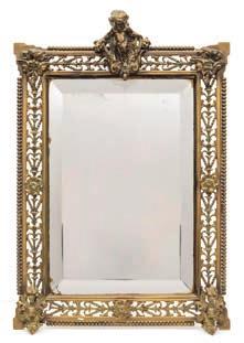 * 100-150 661 A Victorian brass easel frame mirror the bevelled rectangular mirror plate enclosed by a pierced brass frame with