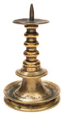* 400-600 719 719 A late 17th century brass pricket candlestick with broad drip tray, triple knopped stem and circular flanged foot, 21cm. high.