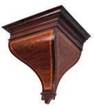 case having brass inlaid decoration to the front, with further inlay and scroll stops to the canted corners and brass fishscale side frets, surmounted by a brass carrying handle to the curved top and