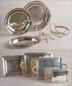 Lots 341-350 Lot #341: Apollo Plate Cocktail Shaker, a Silver Shell-Form Salt and a Wirework Bottle Caddy 1 1/4 to 10 1/4 in. Estimate: $ 50.00 - $ 100.