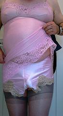 I could hold back no more. I pulled back the lacy hem of my pink slip back from my nylon clad cock and spurted through my satin pink French knickers onto my barely black sheer stockings.