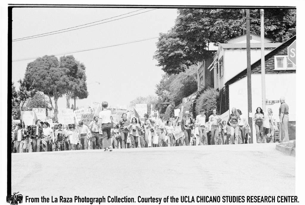 Protesters demonstrate against President Richard Nixon in the "Dump Nixon" march from Echo Park to MacArthur Park Maria Marquez Sanchez, La Raza photograph collection.