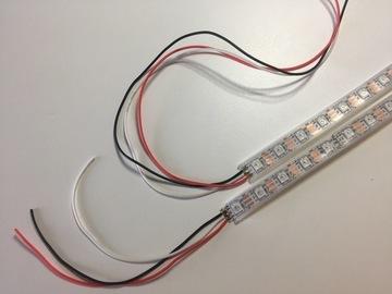 Solder 3 color coded wires to each strip: red to 5v, black to G, and white to IN. The wires should be about 5" long for one strip, and about 10" long for the other.