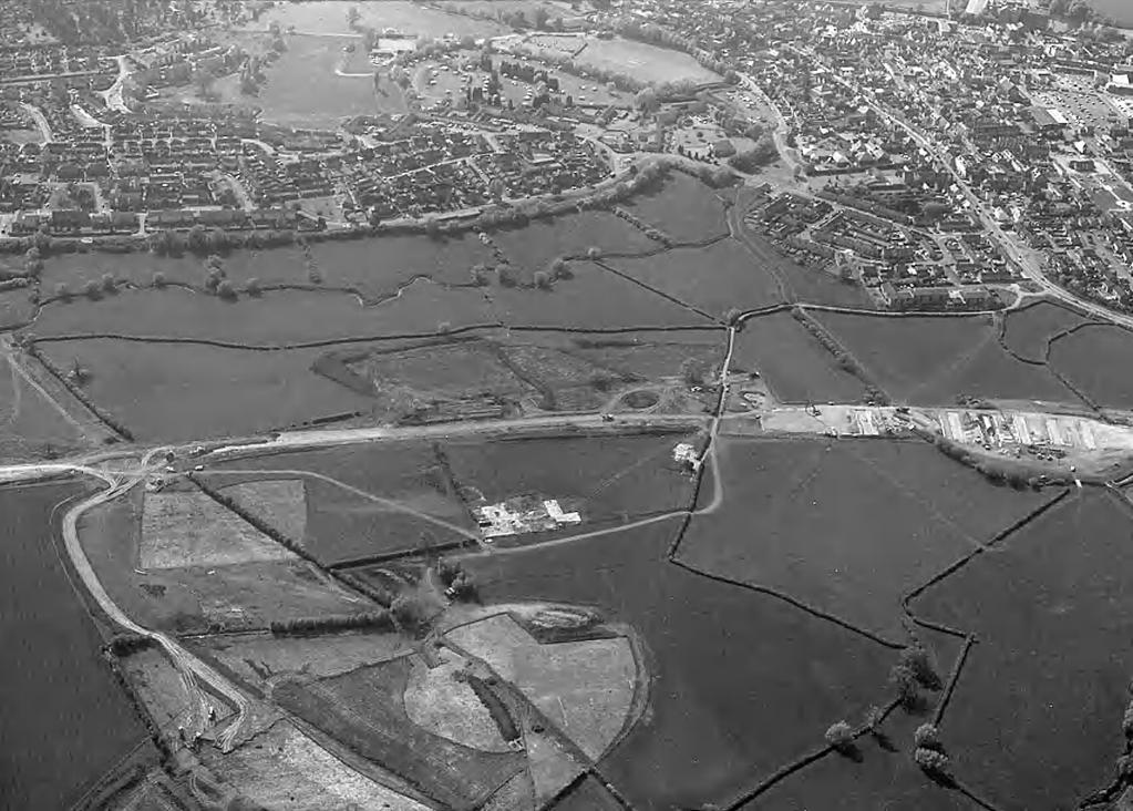 32 GRAEME WALKER, ALAN THOMAS AND CLIFFORD BATEMAN Fig. 3. Aerial view looking west. Area F is bottom centre, with area D to the left and the River Swilgate beyond.