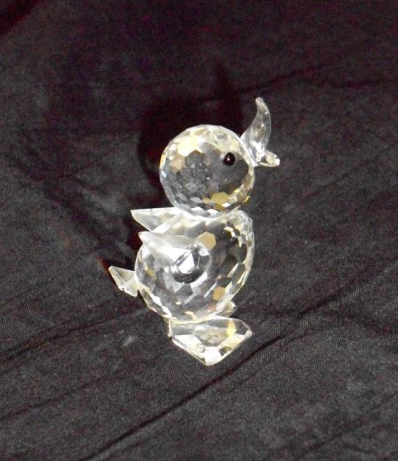 15. Swarovski Crystal Figurine Standing Drake Duck Chick $35 The Victoria Hospice Society AUCTION POLICES 1.