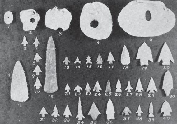 Indian Campsites of the Upper Trinity Drainage 61 Figure 21, Plate 17, is the remains of a beautiful clay pipe. It resembles white stone, but it is of shell tempered pottery. Rockwall III.