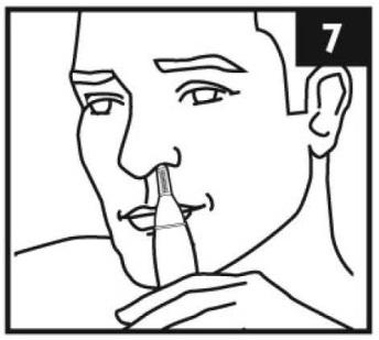 5. Slowly move the trimmer tip in and out of the nostril to remove unwanted hair (see Figure 7). 6. Repeat Steps 4 and 5 for the other nostril. Figure 7: moving trimmer tip in and out 7.