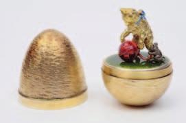 78 A Stuart Devlin modern silver gilt novelty egg, London, 1970, opening to reveal a mouse emerging from a wedge of cheese, 7cm. high No 240, cased.
