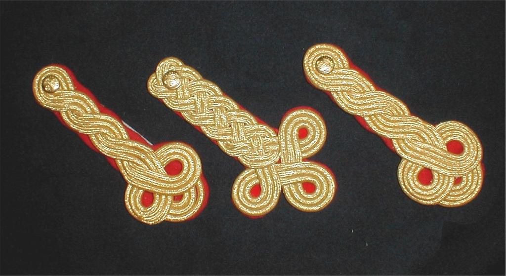 Above right shows the #478 attached to a Marine Officer jacket. All Knots are accurate reproductions. These may be purchased by themselves and include the buttons, attaching hardware and instructions.