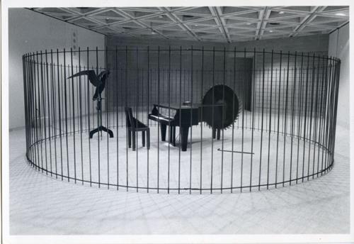Subsequently it was reinstalled at AGNSW in 1995 for the exhibition Through a glass darkly. A grand piano was caged in a circular steel fence.