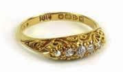 artifi cial pearls (5) 80-120 704 An 18ct yellow gold ring set fi ve graduated diamonds in a marquise shaped scroll work setting, ring size N 1/2, 3.