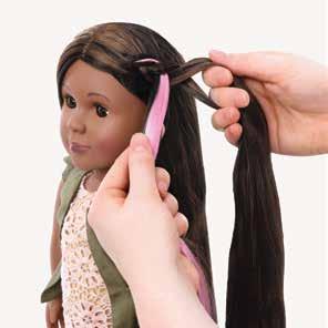 Keep braiding close to the hairline along the side of doll s face.