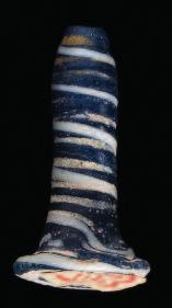 2 3 4 2. Egyptian ear plug or stud of spiralled blue and white glass. Intact. New Kingdom, Amarna Period, c.1352-1336 BC. Length 2.5cm. Provenance: Wallis Collection.