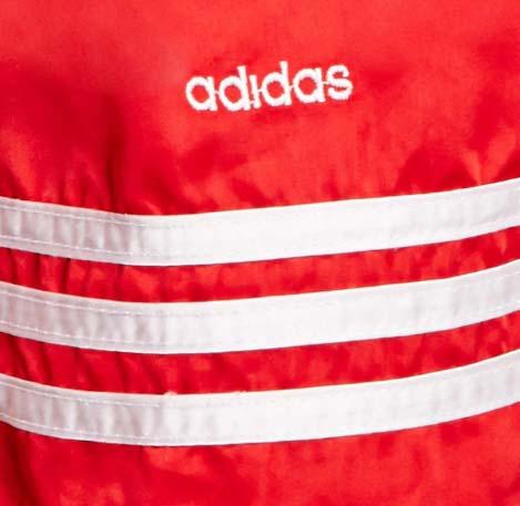 The Infringing Apparel and Footwear and Counterfeit Apparel imitates adidas s Three-Stripe Mark (and, in the case of the Counterfeit Apparel, the ADIDAS word mark and the Badge of Sport Mark) in a