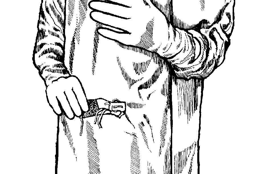 Figure 1-27. Note that the gown cuffs are completely covered and are secured by the cuffs of the gloves. Section VII. FINAL TIE OF GOWN 1-22.