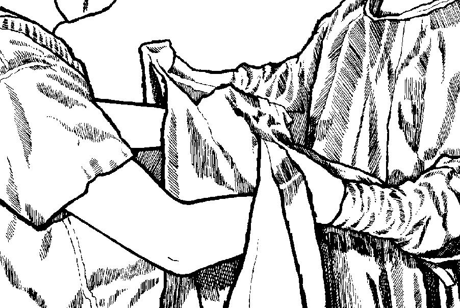 Figure 1-35. The scrub holds a gown for a scrubbed team member. Note that the scrub's gloved hands are protected by the outside of the gown.