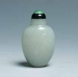 2cm $500-1000 77 A CELADON JADE SNUFF BOTTLE 青白玉鼻烟壶 A snuff bottle of tapered form, the body curved