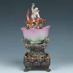 26cm x 24cm $400-700 134 A SHIWAN GLAZED POTTERY FIGURE OF SITTING ZHONGKUI 钟馗石湾人物像 A Shiwan glazed pottery sitting figure, with one