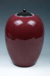 13 A FLAMBE-GALZE JAR WITH WOOD COVER,QING 清窑变釉罐带木盖 The flambe-glazed jar of ovoid shape, the jar is overall covered with a
