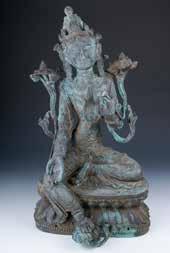 each 226 BRONZE GUANYIN FIGURE 铜观音像 A bronze Guanyin figure, seated in lalitasana on a double lotus base with