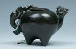5cm $1000-1500 $700-1000 40 A BRONZE TRIPOD WATER POT 鸡头三足铜水注 The bronze container with a globular body, rising from