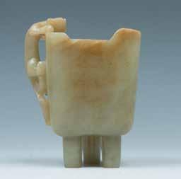 5cm 44 A JADE BRUSH REST, QING 清玉笔架山 The jade brush rest is mimicking the form of a scholar's stone, the stone of celadon tone with