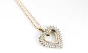 131. A 9ct gold diamond set heart shaped pendant, and chain, the multiple brilliant cuts in