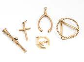 143. Three 9ct gold pendants, including a crucifix, an Aries ram and a wishbone, together with a yellow metal money clip and a 19th Century fob yellow