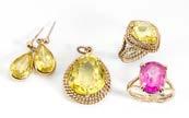 167. A 9ct gold suite of synthetic yellow sapphire jewels, comprising pear shaped cut rope set pendant, mixed oval