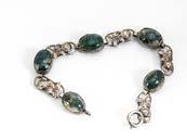 177. An Arts and Crafts style moss agate bracelet, the five oval cabochons alternately set with pierced rose links 50-80 181.