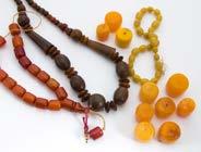 A quantity of amber style beads, including a middle eastern resin prayer bead string, a horn