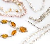 337. A contemporary silver curb link albert necklace, an amber necklace, a fancy link silver