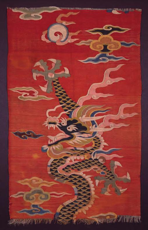 Chinese,18th/19th century Height: 16 cms (6 1/4 inches) Width: 173 cms (68 1/4 inches) 10 A red silk kesi panel, woven with a bold dragon amongst clouds;