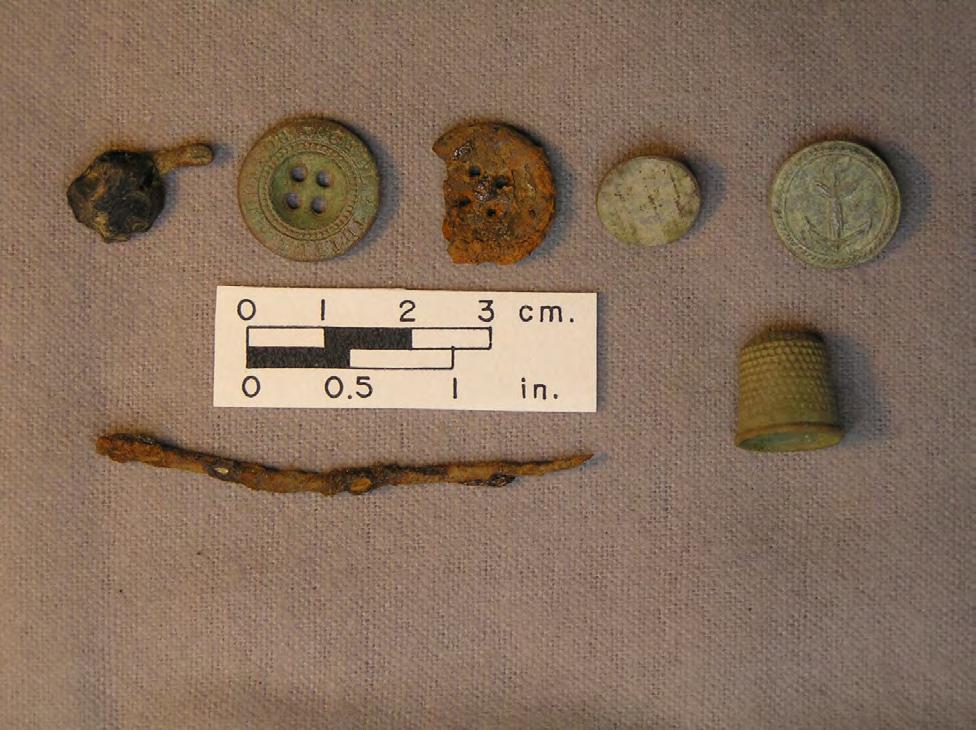 Thwings Point 2011 19 477 922 950 1128 1039 646 1535 Figure 18. Small personal items found. Button #1128 is a small flat brass button with a loop shank.