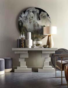 Morrison ottoman 764, Morgan console table 2,645; on console table Gray table lamp 865; on wall Crystal Disk artwork 812; Vinci armchair 3,237, Bessie sidetable