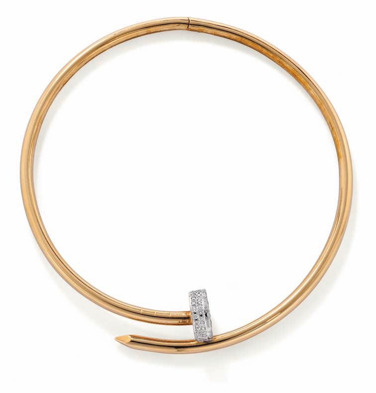 Cipullo Estimate $18,000-22,000 246 A Diamond and Gold Nail Collar ALDO CIPULLO 1972 Designed as a hinged crossover collar necklace, with a pavé-set diamond head, mounted in 18K rose gold, diameter 4