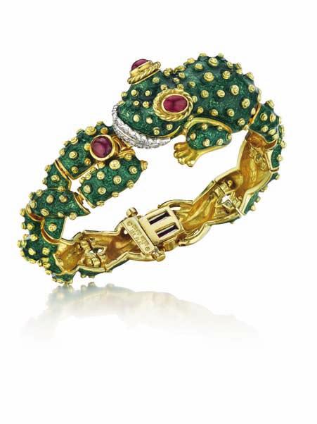 102 103 104 102 An Enamel, Ruby and Diamond Frog Bracelet DAVID WEBB Designed as a green enamel frog, decorated with applied gold spots, enhanced by cabochon ruby eyes and a pavé-set diamond mouth,