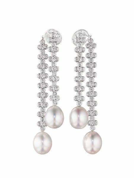 118 119 121 120 118 A Pair of Cultured Pearl and Diamond Ear Pendants Designed as two staggered collet-set diamond floret lines, each terminating in a cultured pearl, measuring approximately 13.