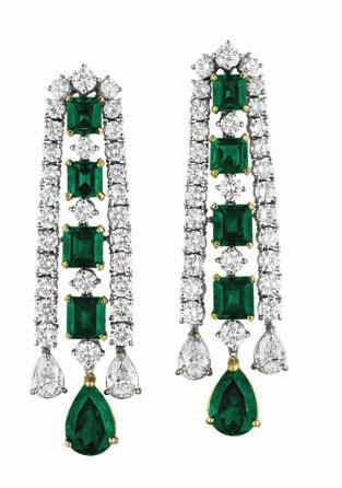 190 190 A Pair of Emerald and Diamond Ear Pendants Of chandelier design, centering upon a line of alternating graduating circular-cut diamonds and square-cut emeralds, within circular-cut diamond