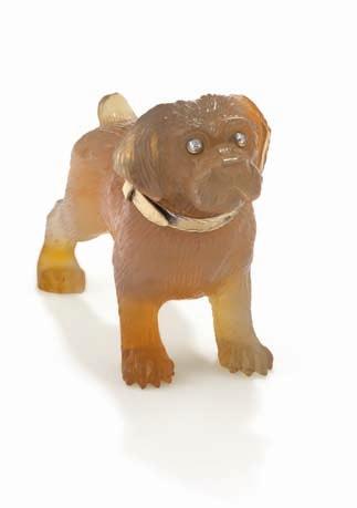 227 227 An Agate Model of a Dog FABERGÉ Designed as an agate dog, carved from a single piece of agate, standing on four legs, accented with rose-cut diamond eyes and a gold collar engraved Faberge,