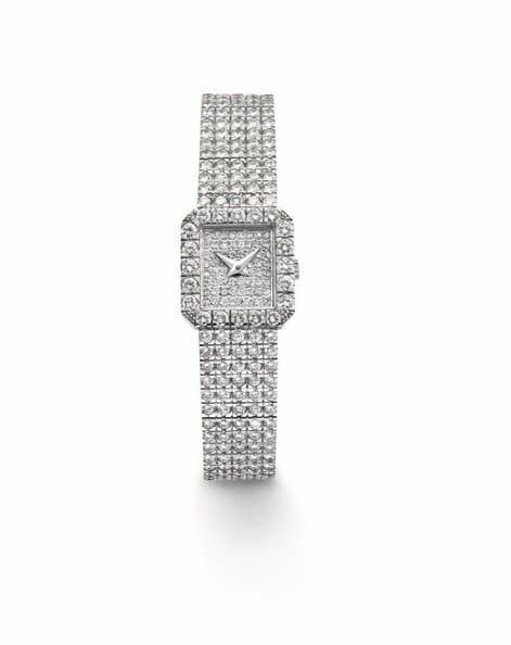 236 237 236 A Diamond Wristwatch PIAGET Of quartz movement, pavé-set diamond dial with dauphine hands and circular-cut diamond-set bezel, to a five-row circular-cut diamond Piaget link bracelet,