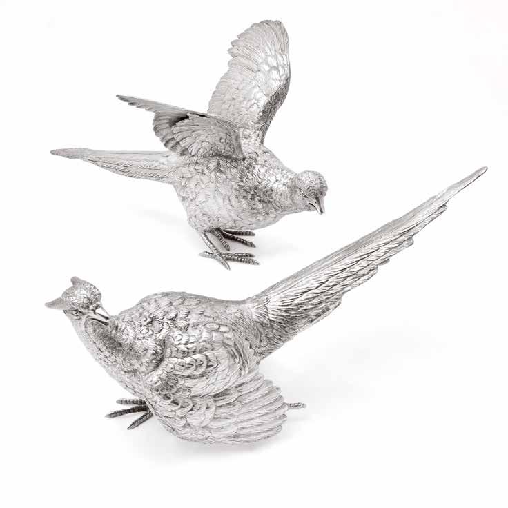 Pair of silver pheasants Hallmarked London Date 1936 Maker attributed to Francis Higgins Length approximately 12 inches ( 30cm ) E & OE Actual size and colour reproduction of articles may not be