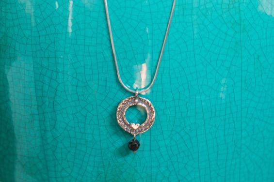 Circular Pendant with Heart and Onyx Bead,