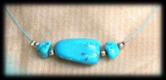 Tiphanie Necklace Turquoise pearls mounted on steel wire sheathed, turquoise colour. Warning!