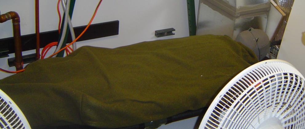 The chemical heating blanket system consisted of a sheet next to the patient, a thin blanket containing the chemical, and an outer radiation shield.