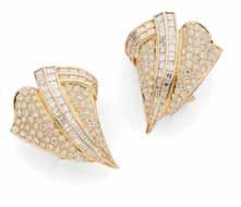 clip, stamped 750 18K Length: 40cm 2,800-3,500 35 A pair of mid-20th century diamond set ear clips each of beaded domed design, claw set at