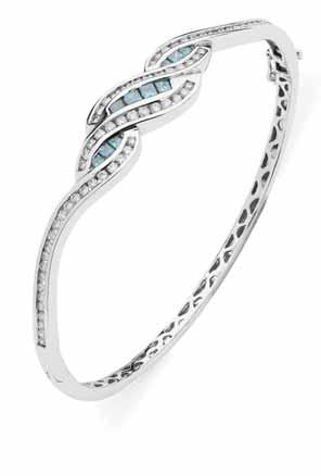 23 48 A contemporary blue and colourless diamond set bangle of hinged design, the scrolling motif set channel