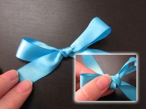 Now cut a piece of ribbon and tie it into a cute little bow.