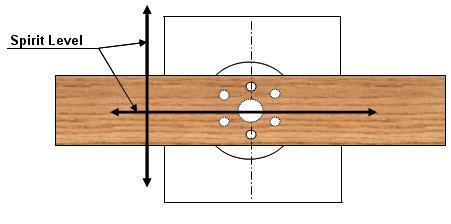 Drill three, M12 holes through the marked positions of the plank. Place the base back onto the plank and bolt the ground base to the plank, from the top of the ground base.