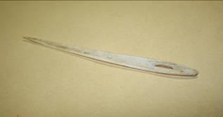 A burin (a flint tool with a chisel edge) would be used to cut lines into bone, the splinter would be levered out and re